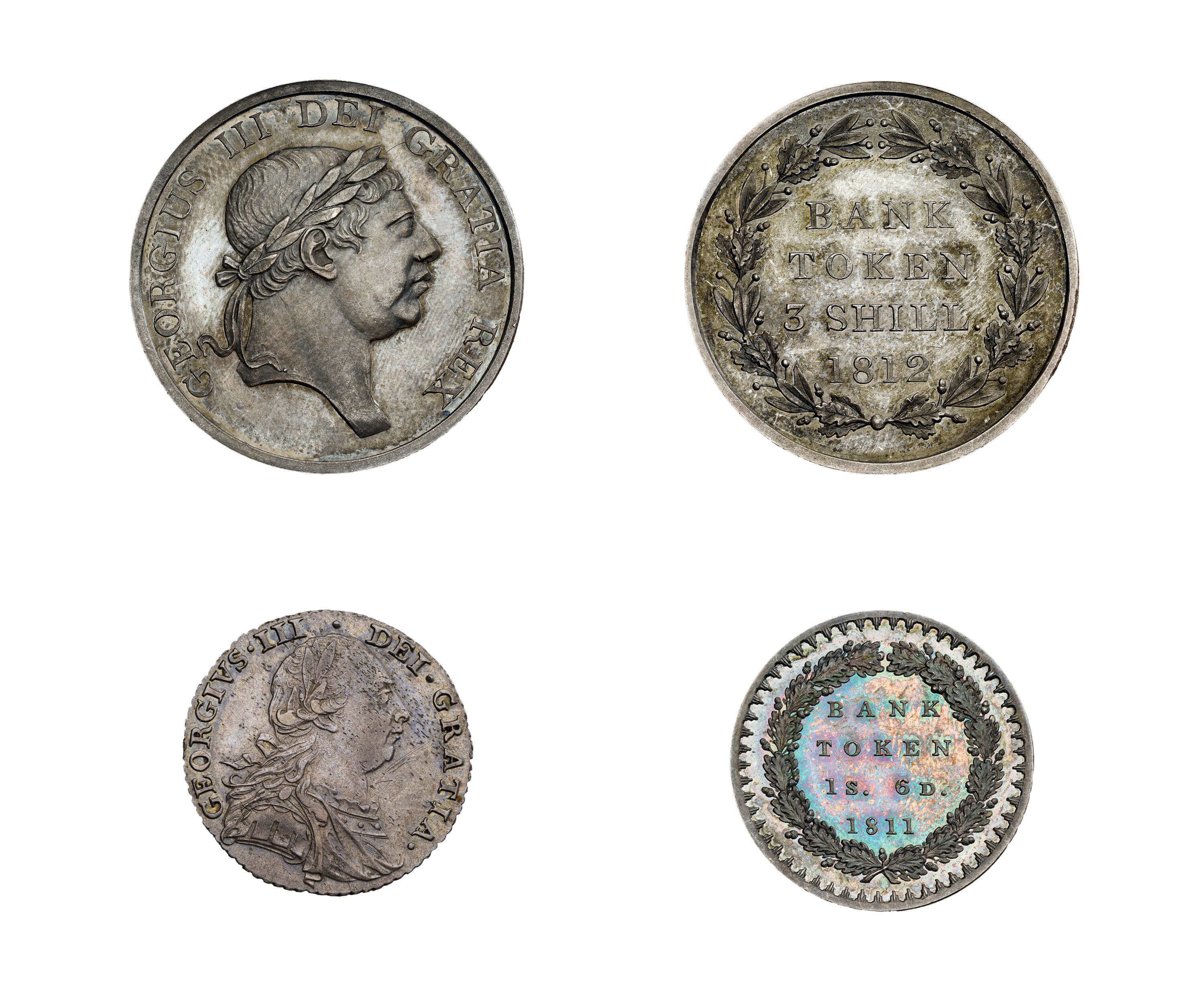 Silver bank of England tokens with the portrait of George III on one side and the denomination struck on the other.
