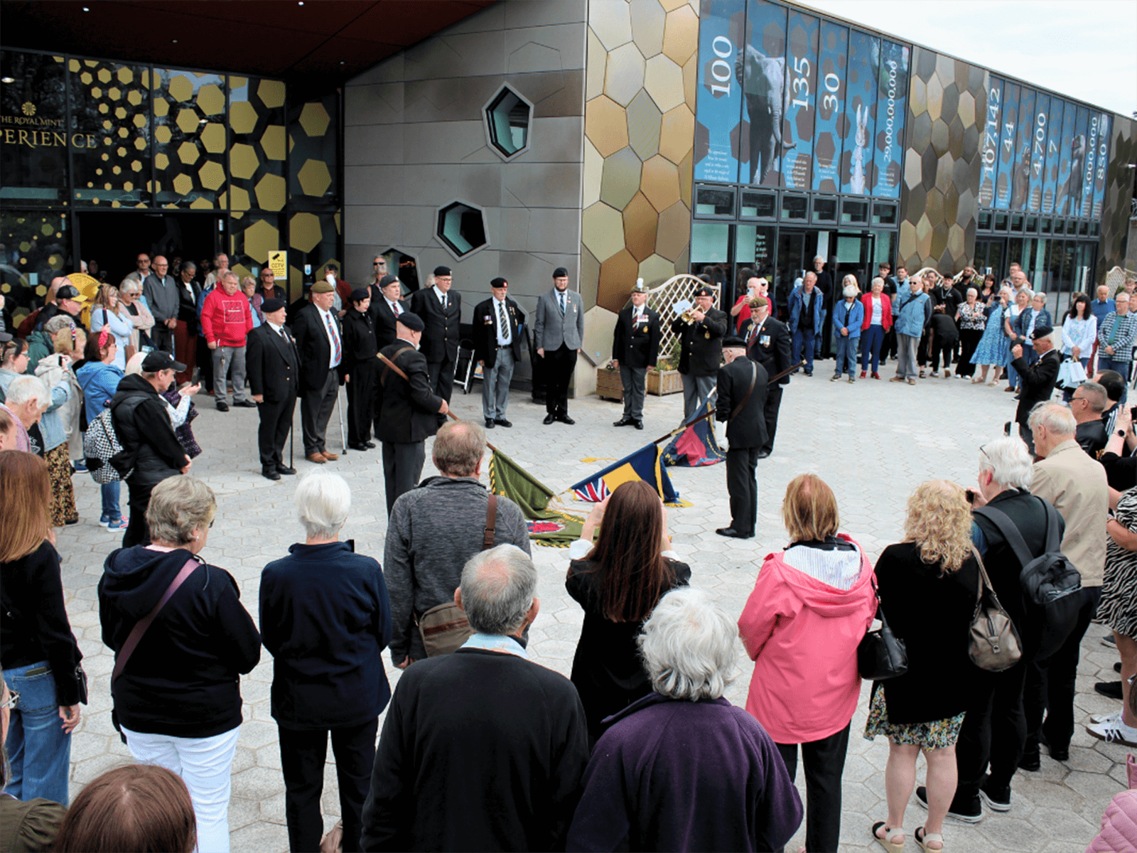 The last post being played at the VE day commemorations at the Royal Mint Experience