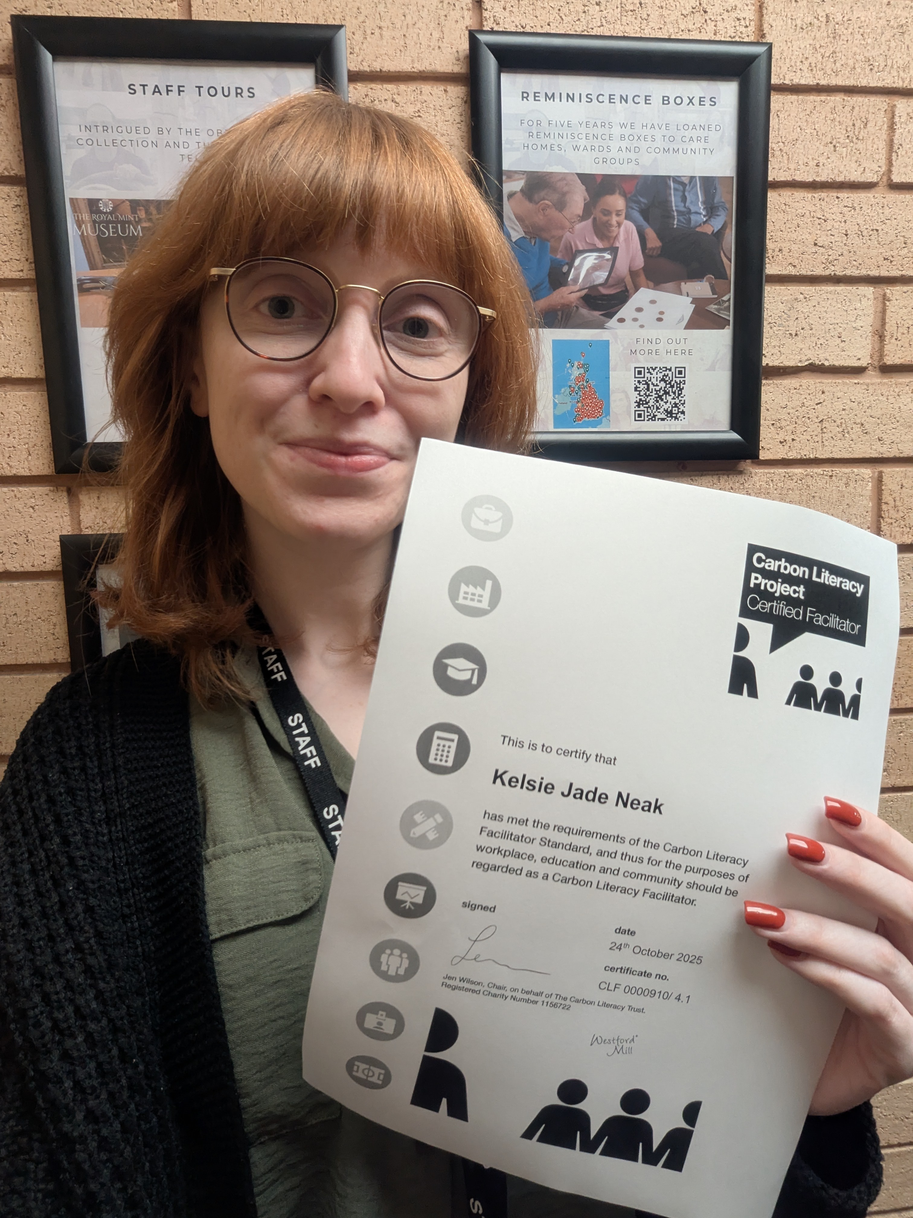 Kelsie with her certificate