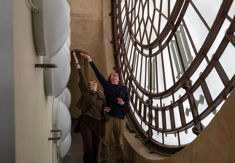 Standing behind the clock face of Big Ben