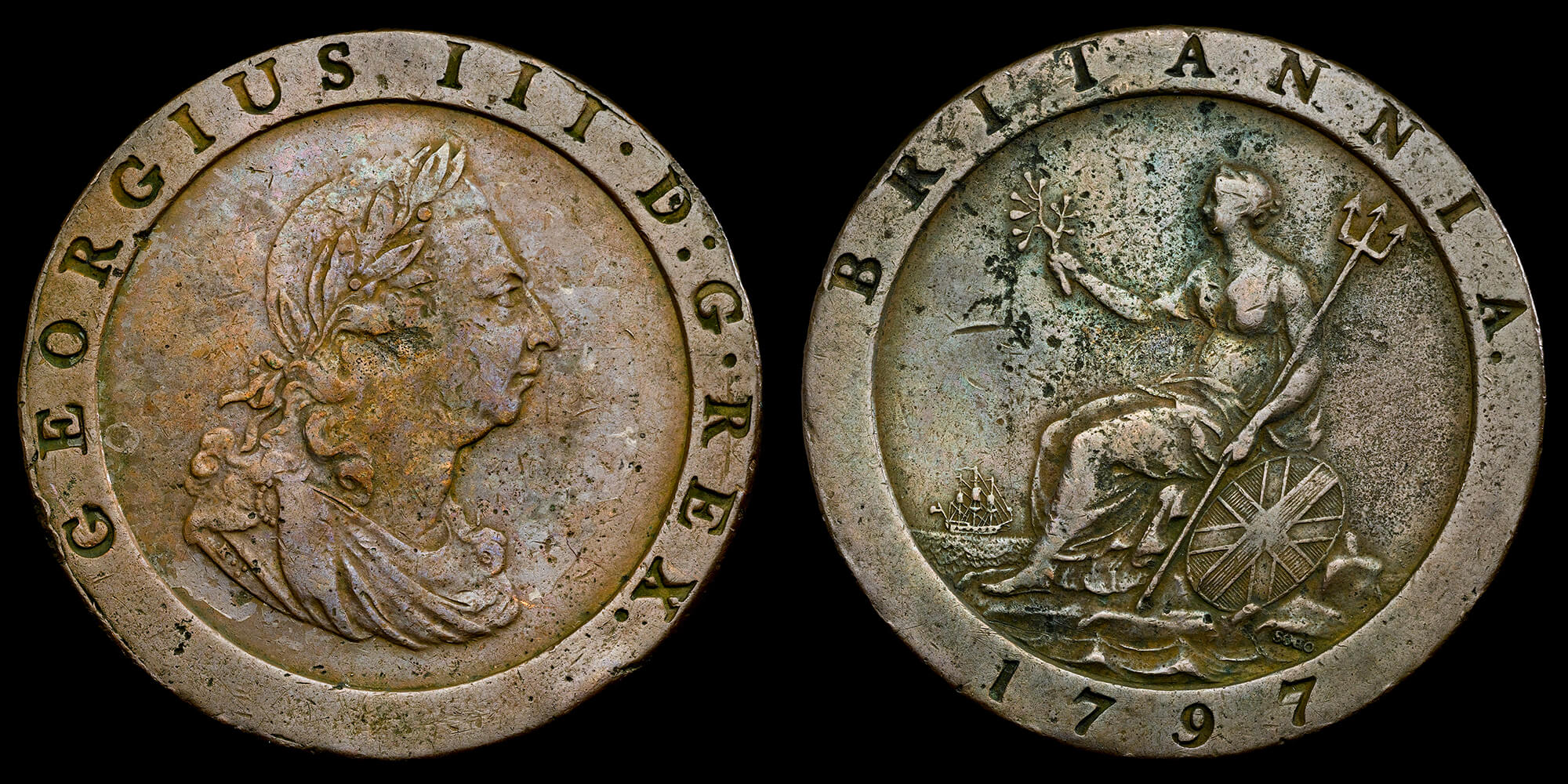 Both sides of the large copper coin known as the 'Cartwheel' penny because of it's size