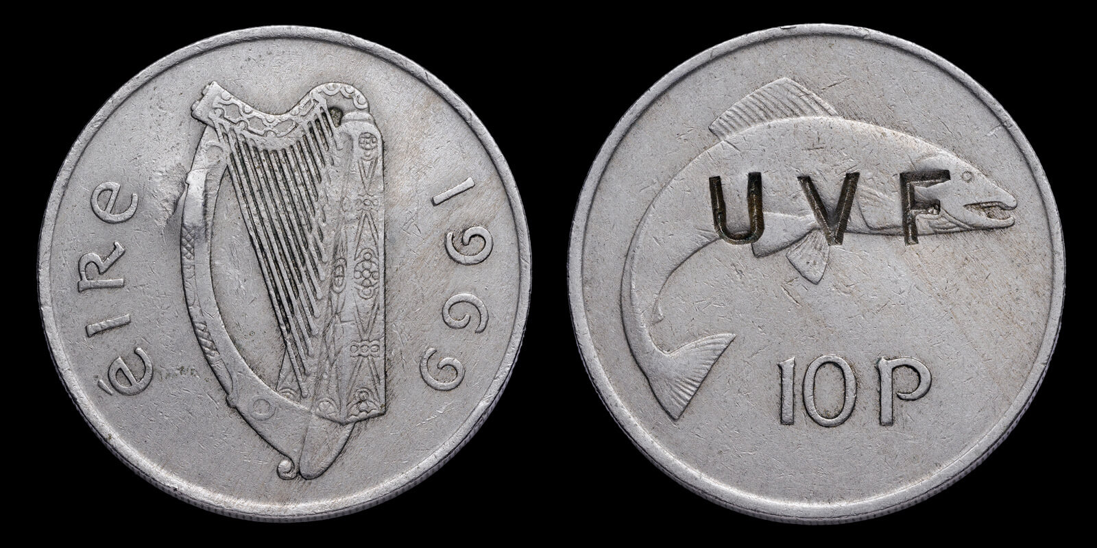 An Irish ten pence coin stamped over with the letters UVF